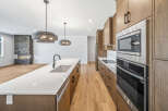 Experience modern luxury in this stunning open-concept kitchen and living area.