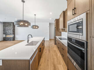Experience modern luxury in this stunning open-concept kitchen and living area.