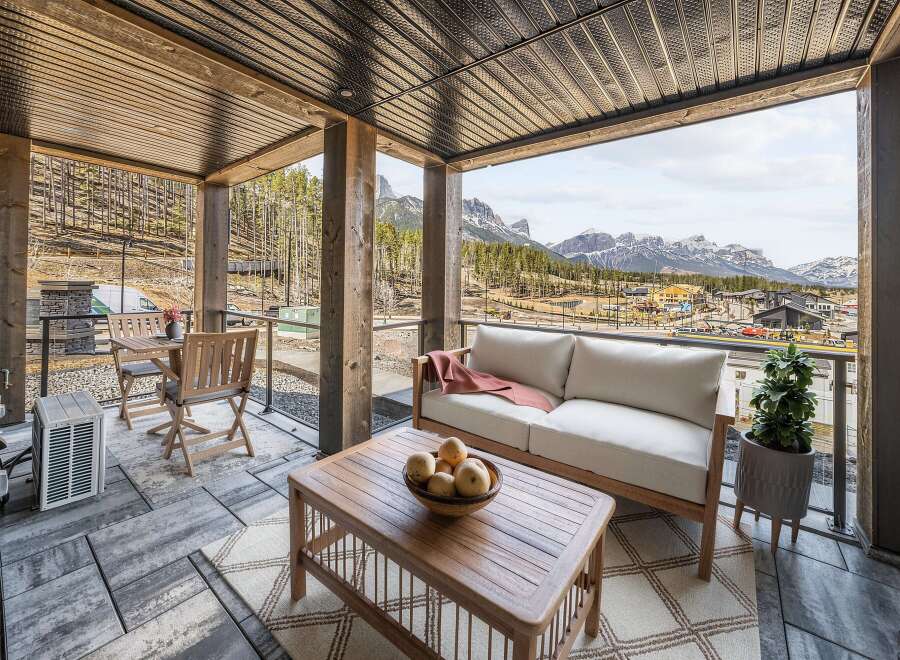 Enjoy breathtaking mountain views from this stunning covered patio, perfect for year-round relaxation.
