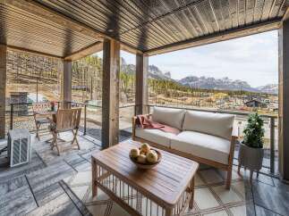 Enjoy breathtaking mountain views from this stunning covered patio, perfect for year-round relaxation.