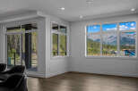 Experience breathtaking mountain views from this stunning property, featuring expansive windows that flood the living space with natural light.