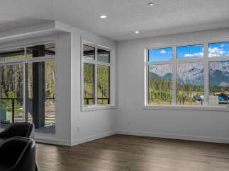 Experience breathtaking mountain views from this stunning property, featuring expansive windows that flood the living space with natural light.