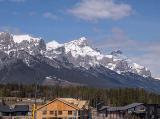 Experience mountain living with this stunning new construction, offering a prime location amidst breathtaking snow-capped peaks.