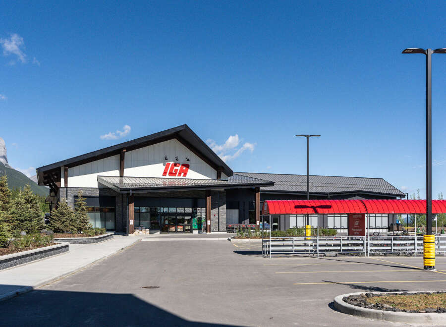 Discover this modern IGA grocery store, featuring a striking architectural design with a prominent IGA logo.
