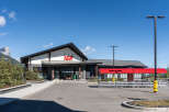 Discover this modern IGA grocery store, featuring a striking architectural design with a prominent IGA logo.
