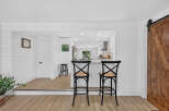 Step into this beautifully renovated home featuring a modern kitchen with a breakfast bar, perfect for casual dining.