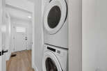 Discover modern convenience with this stacked Amana washer and dryer set, perfect for optimizing space in your laundry area.