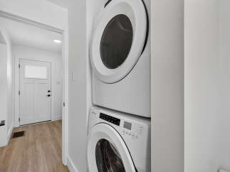 Discover modern convenience with this stacked Amana washer and dryer set, perfect for optimizing space in your laundry area.