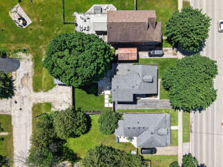 Discover this charming property featuring a spacious backyard with mature trees, perfect for outdoor enjoyment.