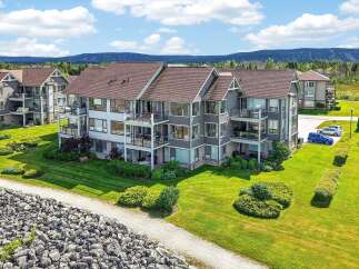 Experience luxury living in this stunning multi-story condo complex, featuring spacious balconies with breathtaking mountain views.