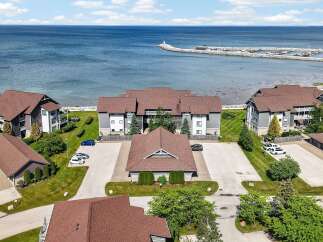 Experience waterfront living with this stunning property offering direct access to the serene blue waters and a private marina.