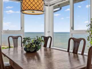 Enjoy breathtaking ocean views from this elegant dining room, perfect for hosting memorable meals.