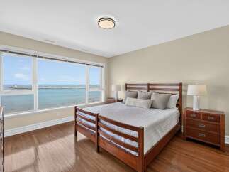 Wake up to breathtaking ocean views from this serene bedroom.