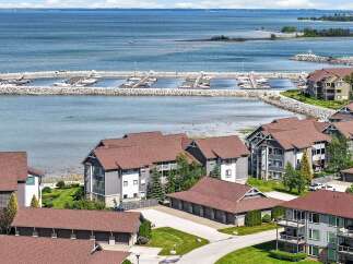 Experience waterfront living at its finest with this stunning property offering direct access to a private marina and breathtaking lake views.