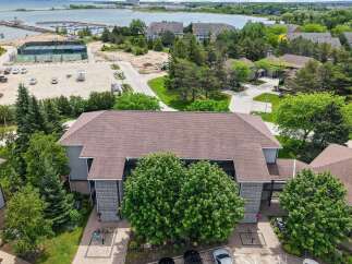Discover lakeside living in this stunning property featuring a marina and tennis courts.