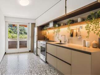 Experience modern living in this beautifully appointed kitchen, featuring sleek cabinetry, a gas stovetop, and a double sink.