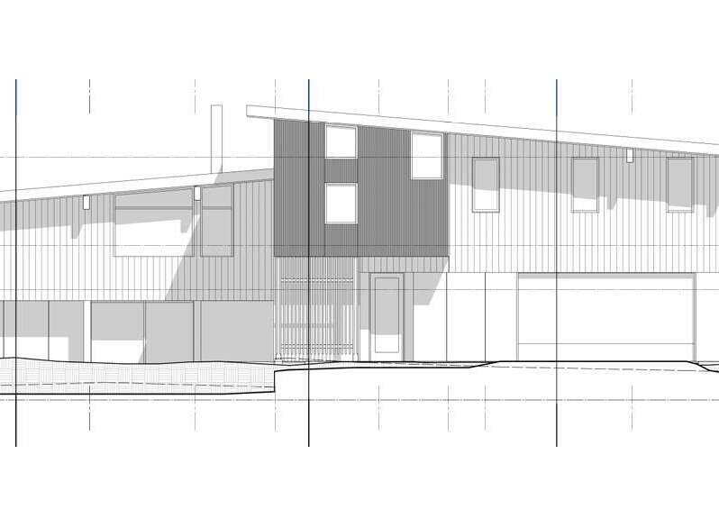 This architectural drawing showcases a modern, multi-level home with a distinctive sloped roofline.