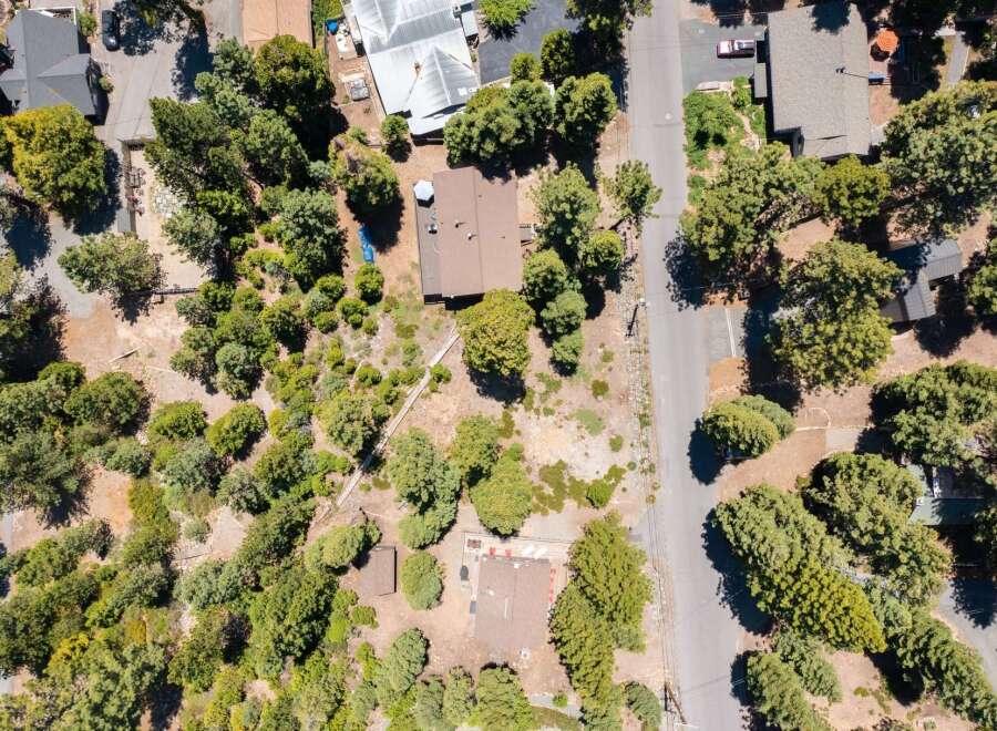 Discover this charming property nestled amongst mature trees, offering a private and serene setting.