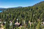 Nestled amidst a dense forest of towering pine trees, this property offers a serene and private retreat.