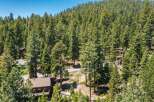 Nestled amidst a dense forest of mature pine trees, this property offers a serene and private mountain retreat.