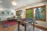 Enjoy endless entertainment in this spacious living area, featuring a fun foosball table perfect for game nights.