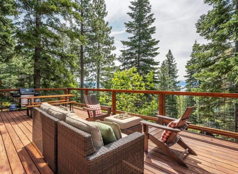 Enjoy breathtaking lake views from this stunning deck, perfect for outdoor entertaining.