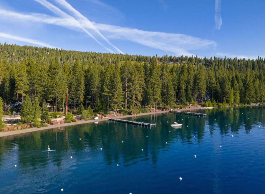Experience luxury lakeside living with this stunning property featuring a private dock and direct access to crystal-clear waters.