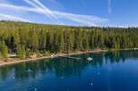 Experience luxury lakeside living with this stunning property featuring a private dock and direct access to crystal-clear waters.