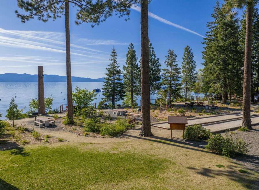 Enjoy lakeside living with this stunning property featuring direct water access and breathtaking mountain views.