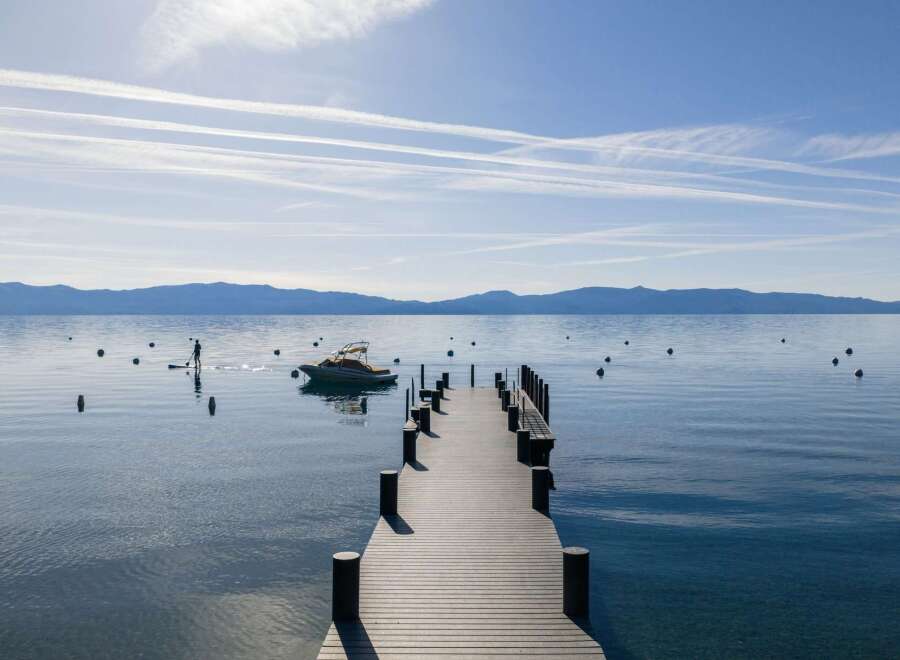 Experience serene lakefront living with this stunning property featuring a private dock perfect for launching paddleboards or enjoying a quiet morning on the water.