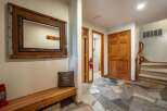Step into this inviting entryway featuring rustic charm and practical amenities.