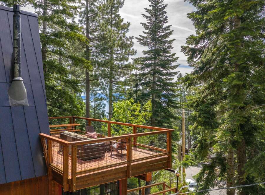 Experience breathtaking lake views from this stunning multi-level deck, perfect for outdoor entertaining and relaxation.