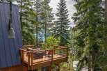 Experience breathtaking lake views from this stunning multi-level deck, perfect for outdoor entertaining and relaxation.