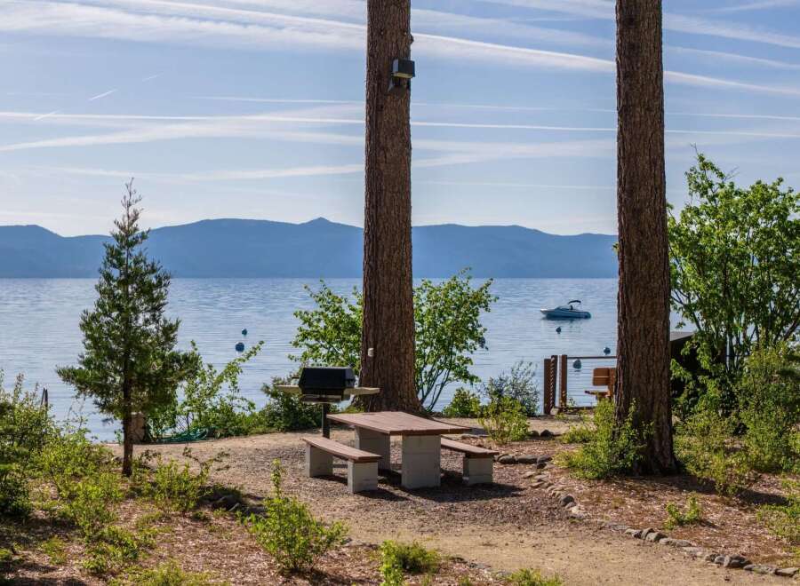 Enjoy breathtaking lake views from this serene lakeside property, perfect for outdoor entertaining.