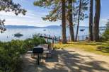 Enjoy lakeside living with this stunning property featuring a private dock and barbecue area.