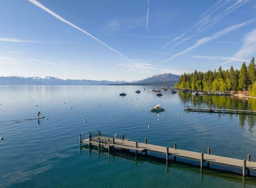 Experience the ultimate lakeside lifestyle with this stunning property featuring a private dock and direct access to crystal-clear waters.