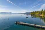 Experience the ultimate lakeside lifestyle with this stunning property featuring a private dock and direct access to crystal-clear waters.