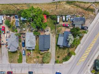 Discover this unique property featuring multiple dwellings and ample outdoor space, perfect for investors or those seeking a multi-generational living solution.