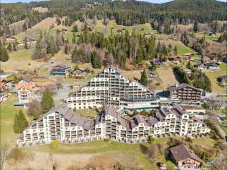 Discover this stunning multi-building complex nestled in a picturesque mountain landscape.