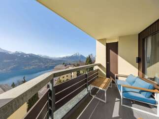 Enjoy breathtaking mountain and lake views from this stunning balcony, perfect for your morning coffee or evening relaxation.
