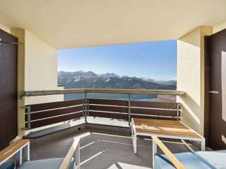 Enjoy breathtaking mountain and lake views from this stunning balcony, perfect for relaxing or entertaining.