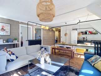 Experience chic urban living in this stylish apartment, featuring a spacious open-plan living and dining area perfect for entertaining.
