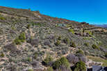 Nestled on a scenic hillside, this property offers breathtaking views and a sense of secluded luxury.