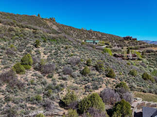 Nestled on a scenic hillside, this property offers breathtaking views and a sense of secluded luxury.