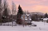 Experience the charm of this historic Victorian home nestled in a picturesque winter wonderland.