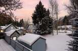 Experience the magic of winter with this charming property nestled amidst snow-covered trees and mountains.