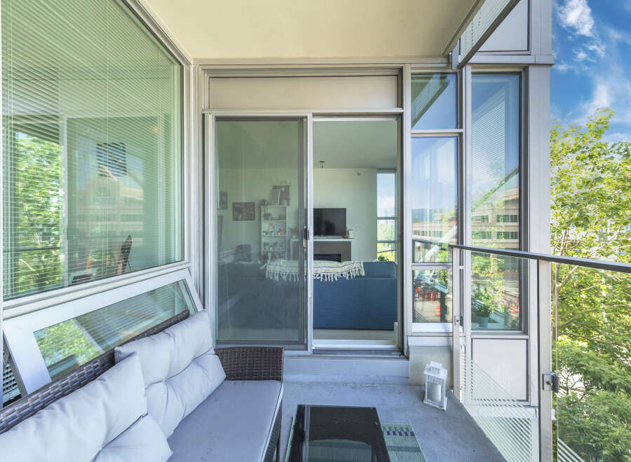 Enjoy outdoor living on this spacious balcony, perfect for relaxing or entertaining.