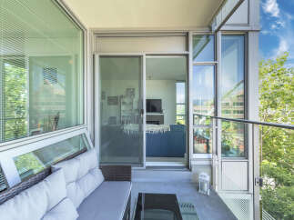 Enjoy outdoor living on this spacious balcony, perfect for relaxing or entertaining.