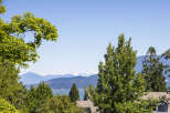 Experience breathtaking panoramic views of snow-capped mountains and sparkling blue waters from this stunning property.