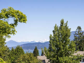 Experience breathtaking panoramic views of snow-capped mountains and sparkling blue waters from this stunning property.